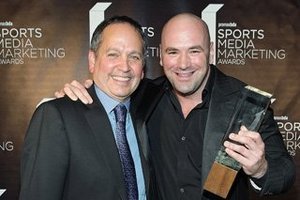 256026-kevin_kay_l_president_of_spike_tv_presents_the_game_changer_award_to_ufc_president_dana_white_at_promaxbda_s_sports_media_320x302_large_large.jpg