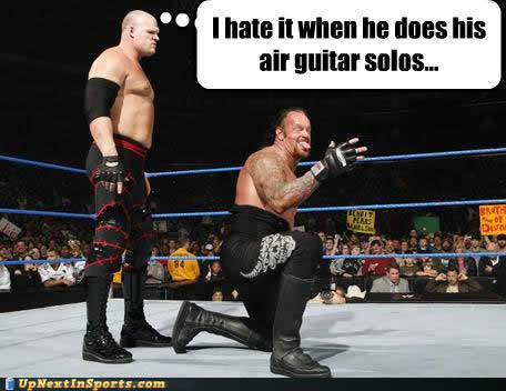 funny-sports-pictures-kane-undertaker-air-guitar1.jpg