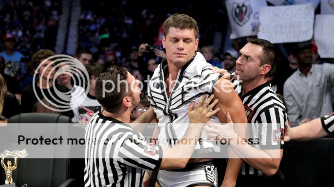 Refrees-Trying-To-Stop-Cody-Rhodes_zps03240119.jpg